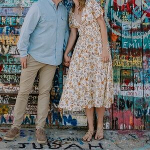 Light yellow, floral dress with plunge neckline and capsleeves